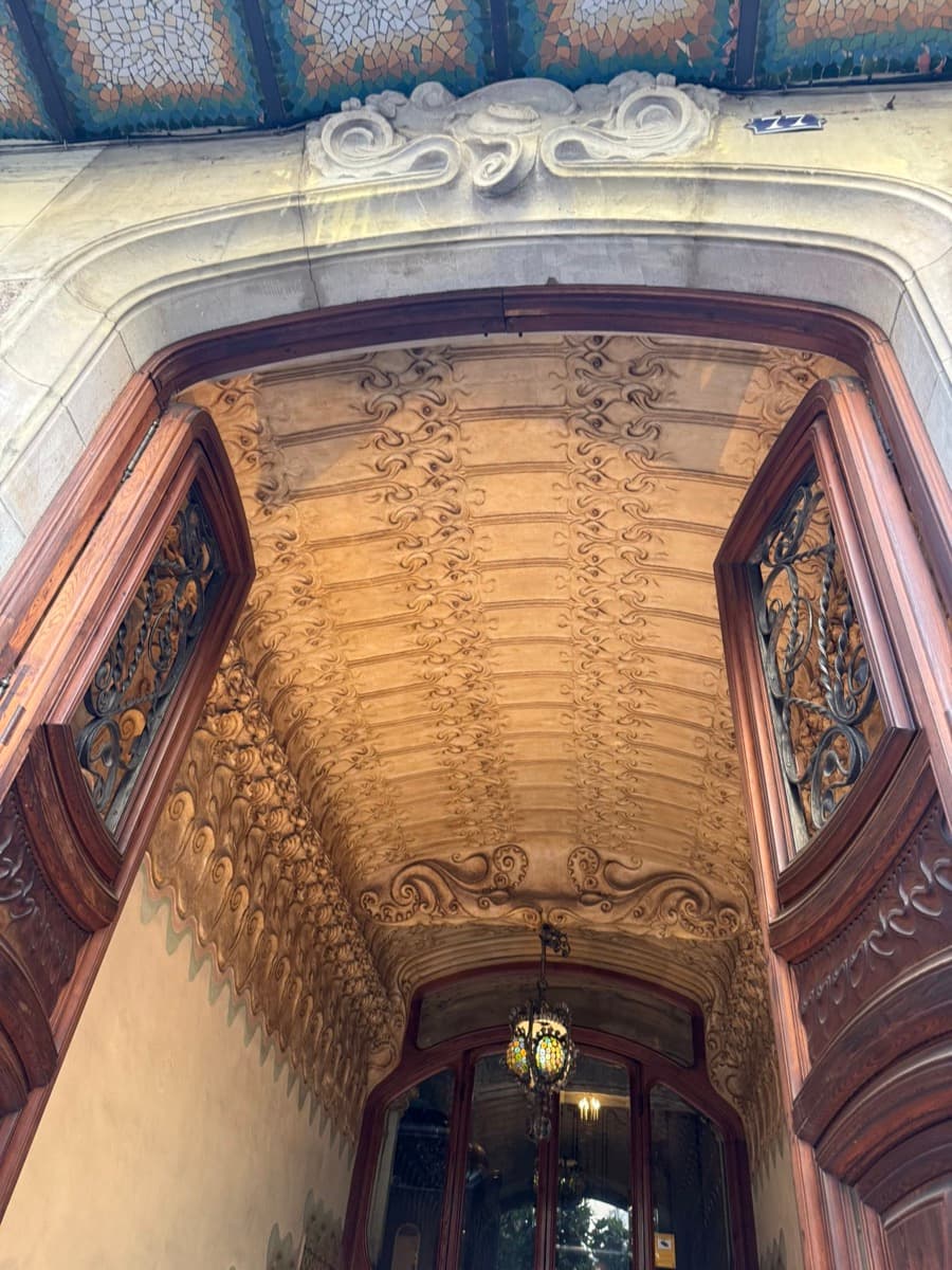 Carved stone archway over a Barcelona doorway